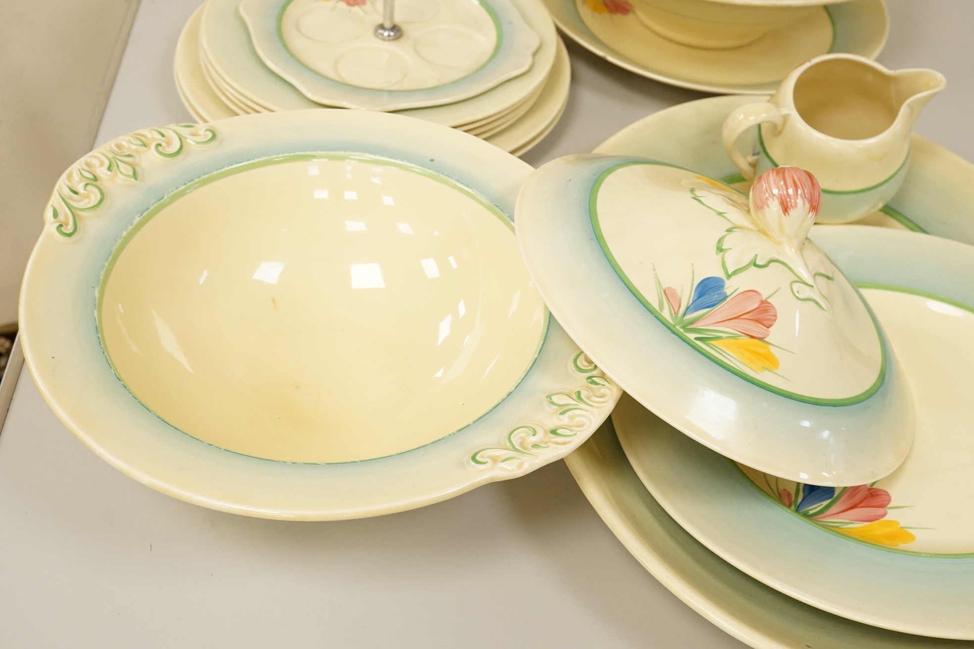 A collection of Clarice Cliff, Newport Pottery and Spring Crocus pattern tableware
